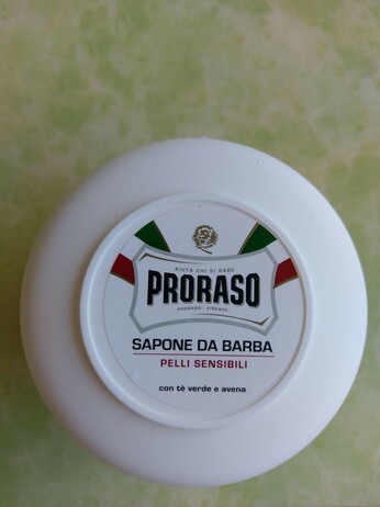 A small tub of shaving soap.
