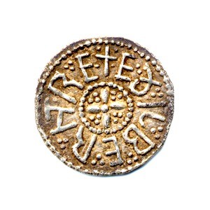 Colour photograph of the obverse of an Anglo-Saxon silver coin. Inscription reads: 'Aethelberht Rex'