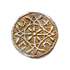 Colour photograph of an Anglo-Saxon silver coin with an intricate geometric design.