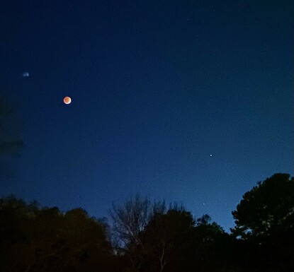 Lunar eclipse with waning shadow in the morning sky