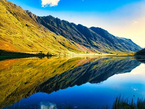 A photograph of Loch Achtriochtan and the Aonach Eagach ridge in Glencoe.