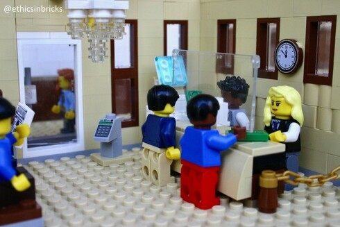 Minifigs queuing before counter
