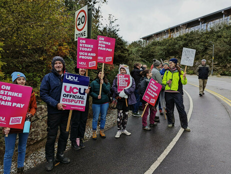 Picket line on Penryn campus - determined people with placards about working conditions, real time pay cuts and unfair cuts to pensions