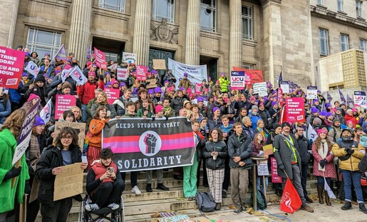 Crowd of hundreds of union members overspilling the steps of the University of Leeds Parkinson Building, including prominent banner for Leeds Student Staff Solidarity
