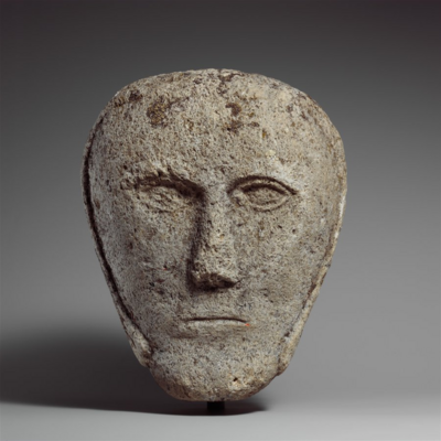 image of a sculpted head of a man - very simple, "Head of a Man Wearing a Cap or Helmet" celtic, brittish isles -  Medium: Fossiliferous limestone