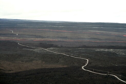 Lava flows cut through two sections of the Mauna Loa Observatory road. USGS photo: https://www.usgs.gov/media/images/lava-flow-cutting-mauna-loa-observatory-road