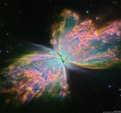 This sharp close-up was recorded by the Hubble Space Telescope and is processed here to show off remarkable details of the complex planetary nebula, highlighting in particular light emitted by oxygen (shown as blue), hydrogen (green), and nitrogen (red). In all, it looks like a giant butterfly flapping its wings in space.
