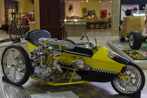 Arlen Ness' custom trike, Taxi, made with a 1000cc Sportster engine and absolutely bleeding style through every chrome and two-tone surface.