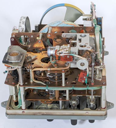 The Globus with the case removed, showing the complex gearing and mechanisms inside.