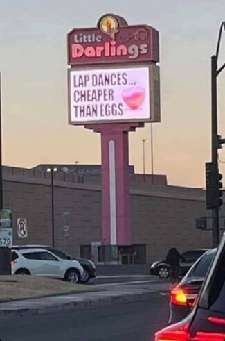 strip club sign reading 'Lap Dances....cheaper than eggs'
