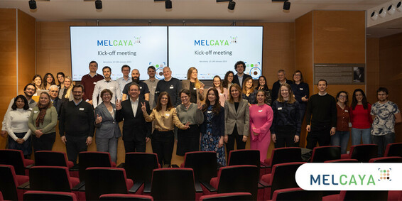 Professors Susana Puig, project leader, and Inès Brecht, workpackage leader, along with dozens of additional experts including myself and representatives of patient groups to work on the predispositions to and treatments for melanoma in infants, children, adolescents and young adults. Standing in front of two screens describing "MELCAYA kick-off meeting" in Barcelona on 13 January 2023.