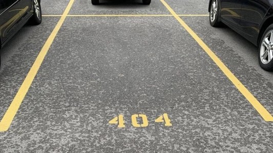 Empty car space numbered 404.