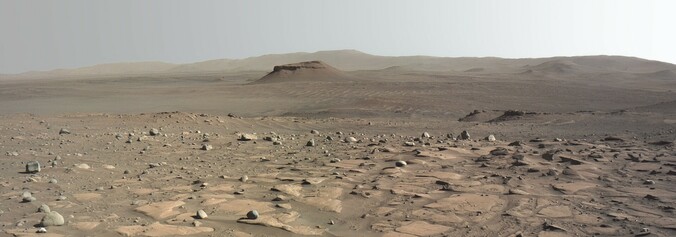 Kodiak mesa in the distance across the Jezero Crater floor. Decorrelated color.