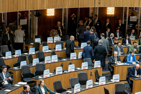 Austrian MPs from the right-wing Austrian Freedom Party (FPOe) leave the assembly room as a sign of protest during a video address by Ukraine's President Volodymyr Zelensky amid a session of the Austrian National Council in Vienna, Austria, on March 30. (Christian Bruna/EPA-EFE/Shutterstock)