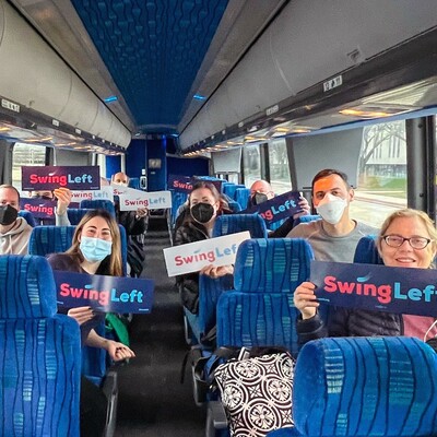 Swing Left volunteers abroad a bus headed to knock doors in Wisconsin on Saturday.