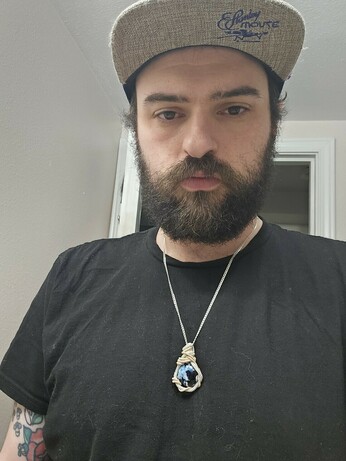 Selfie of boss bitch ashley rocking the pendant on a black tee
