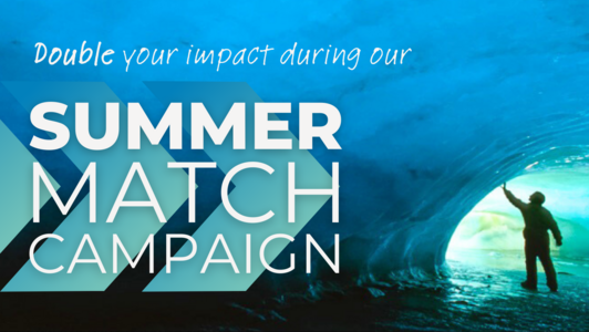 Photo of a scientist in an ice cave. Text overlay reads "Double your impact during our Summer Match Campaign"