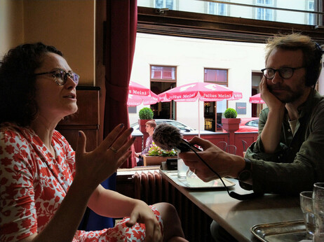 Photograph of Sandra Mayer being recorded by radio producer Geoff Bird.