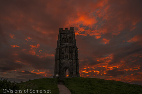 Bright red sky behind the tower.