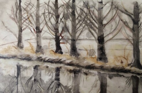 A row of six winter trees which are mirrored in a little river that's in the front. In the background is a snow covered field. The colours are mainly white, black, grey and some shades of beige and brown.