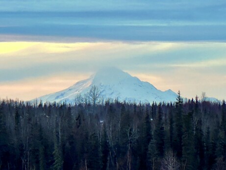 Snow-covered Mt. Redoubt at sunset.