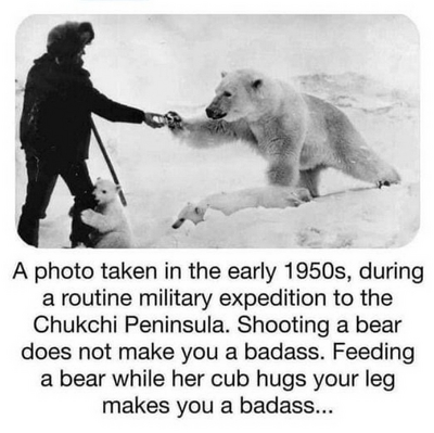 A photo taken in the early 1950s, during a routine military expedition to the Chukchi Peninsula. Shooting a bear does not make you a badass. Feeding a bear while her cub hugs your leg makes you a badass...