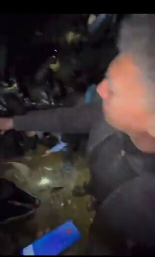 screen capture of video showing palestinian father desperately trying to locate and save his daughter