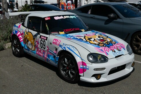 Gray Kei Car coupe with Aggretsuko anime vinyl wrap.