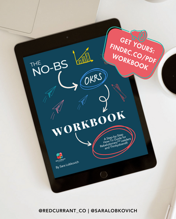 In the foreground is a bright red overlay reading: Get Yours: findrc.co/pdfworkbook. In teh background is the No-BS OKRs Workbook cover on a tablet, laying on a desk next to a laptop and a cup of coffee. The cover is dark blue, with bright hand-drawn scribbles of paper airplanes, graphis, and a pencil. The copy reads: The No-BS OKRs Workbook: A Step-by-Step How-To Guide for Rebelutionary Leaders and Thinkydoers.