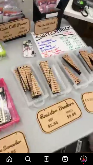 Breadboarding supplies on a gray table - jigs for bending resistors and the SwitchTrick breadboard power supply