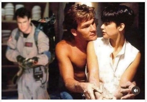 Patrick Swayze and Demi Moore sit at the potters wheel in the famous scene from the 1990 movie Ghost. 
In the background. Dan Aykroyd from the 1984 comedy Ghostbusters readies his proton pack.