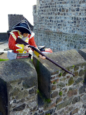 castle battlements, and soldier taking aim