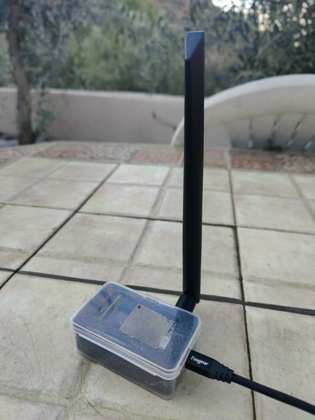 A tiny Lillygo LoRa board with antenna hooked up to my Meshtastic network