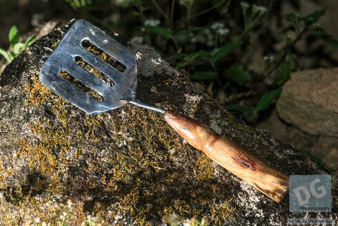 Original circe 2018 egg-flip showing how the thing shank of the flipper was inserted in to the end of a turned wooden handle.