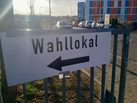 Sign directing me where to go vote.