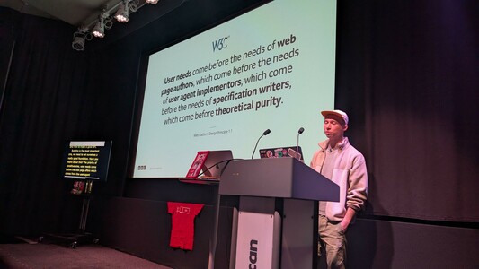 Josh on stage speaking
