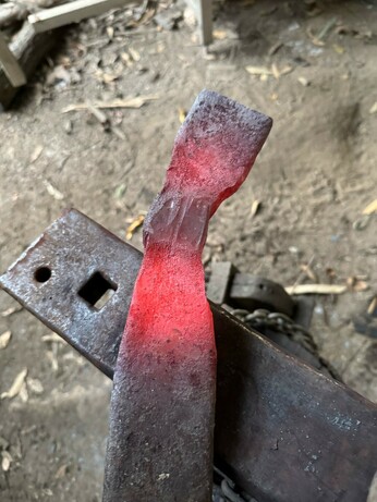 Hot metal bar. One end isolated for the axe blade and the eye section upset so it’s is thicker. The eye is mostly done.