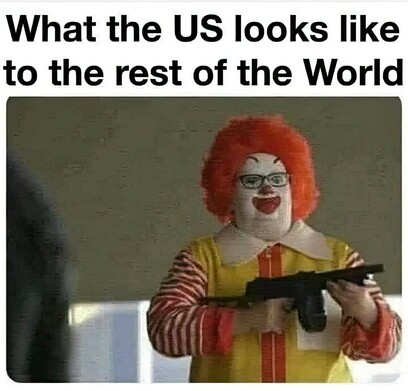 a man dressed as Ronald McDonald totes a children's toy automatic weapon. Tagline: "What the US looks like to the rest of the World."