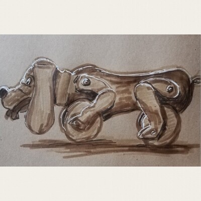 A drawing in sepia on brown paper with white highlights, showing an old wooden dog with wheels and articulated legs. He reaches from edge to edge of the paper.