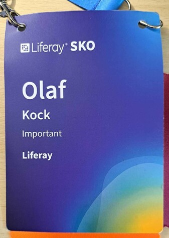 An event name tag, featuring the job title "Important"