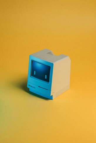 a miniature Mac Classic toy