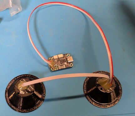 The back-side of the assembly, showing the wires and the circuit board.