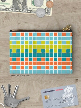 Abstract grid of multi-color squares printed on a zipper pouch