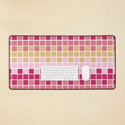 Abstract grid of multi-color squares printed on a desk mat
