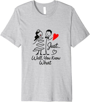 Five t-shirts in different colors (white, light blue, gray, pink, and white) featuring a hand-drawn design of a couple holding a red heart, with the text 'Just... Well You Know What' in black. The designs are displayed against a plain background, available for purchase on Amazon Fashion, Amazon Merch, and Fine Art America.