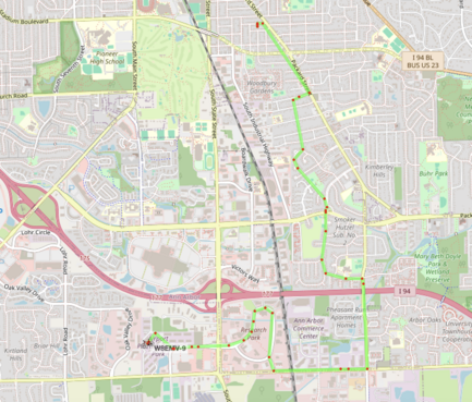 A faint green line with red dots shows the track of W8EMV-9, an APRS transmitter with a bicycle icon. 

The destination is the Ann Arbor Airport, but I stopped for coffee.