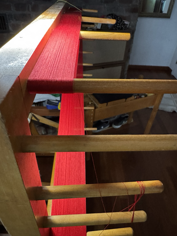 A different view of the warping frame. In this case I’ve compressed the 500 threads so they take up less space and I have room to fit 800. Normally I would only be able to fit 100-200 threads on this frame at a time.