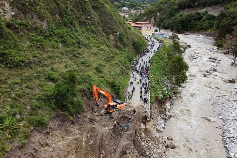 A drone view shows a section of the Trans-Andean highway that was destroyed by a landslide following floods, in Los Aleros, Venezuela.