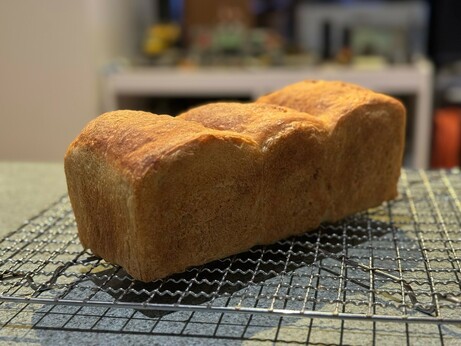 Three dome sandwich loaf on a cooling rack.
