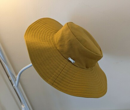 Another angle, showing metal eyelets at the side which the tie is threaded through